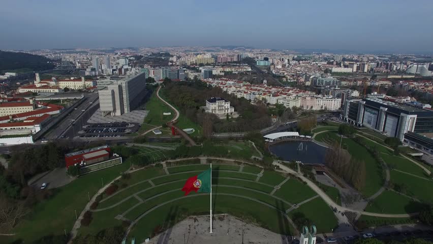 Portuguese Waving Flag on top of the Eduardo VII Park in Lisbon, Portugal