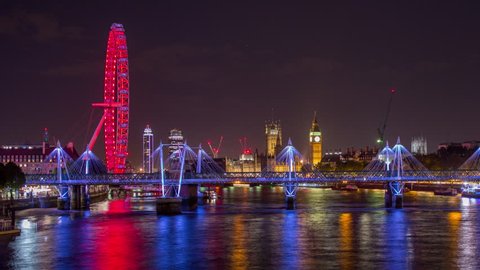 nighttime timelapse view of london skyline from waterloo bridge  with amazing reflections of light on the river thames