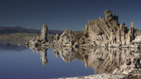 Tufas reflect in Mono Lake.
