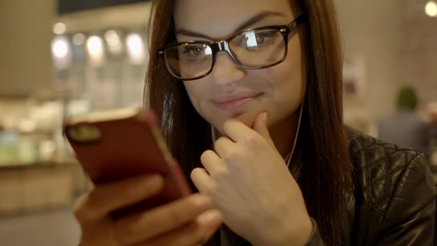 beautiful young caucasian women using smart phone and drinking a coffee. urban business people lifestyle background