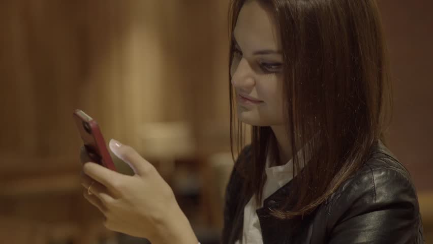 beautiful young caucasian women using smart phone in the city commuting to work. urban business people lifestyle background