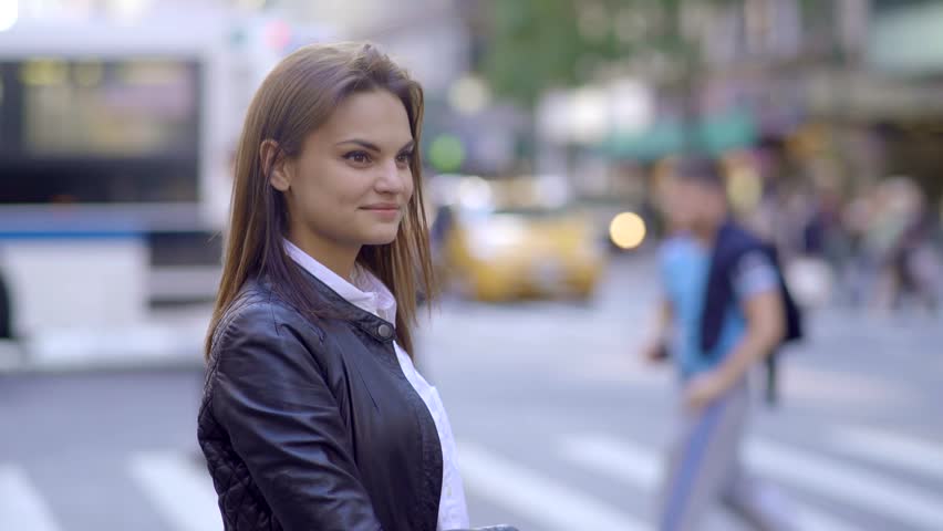 beautiful young caucasian women using smart phone in the city commuting to work. urban business people lifestyle background
