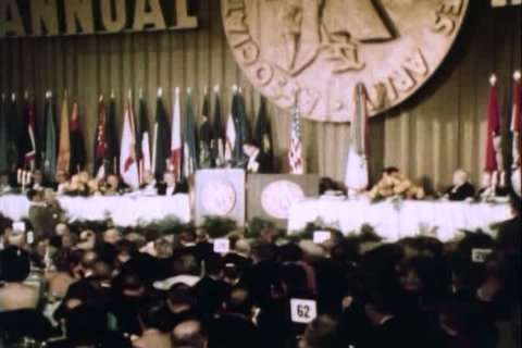 CIRCA 1970s - A presenter gives a speech and offers awards at the AUSA military convention in Washington D.C. in the 1970s.