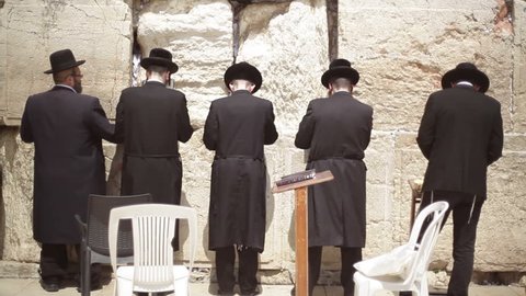 ISRAEL - CIRCA JUNE 2015 -5 hasidic orthodox jewish men pray and worship, Wailing Wall, Jerusalem