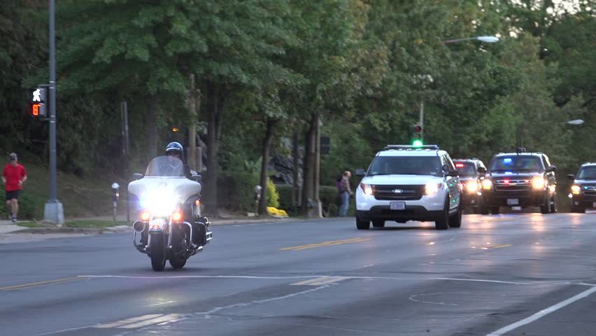 WASHINGTON, DC - DEC. 2015: Motorcade transporting president. Secret Service vehicles race down street, Major highway closed,follow on ambulance -- this is how presidential motorcade travels.