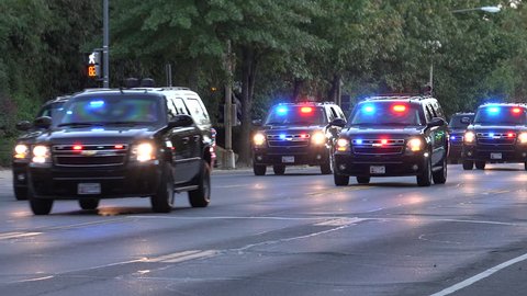 WASHINGTON, DC - DEC. 2015: Motorcade transporting president. Secret Service vehicles race down street, Major highway closed,follow on ambulance -- this is how presidential motorcade travels.