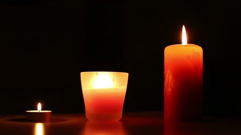 three lighting candles 