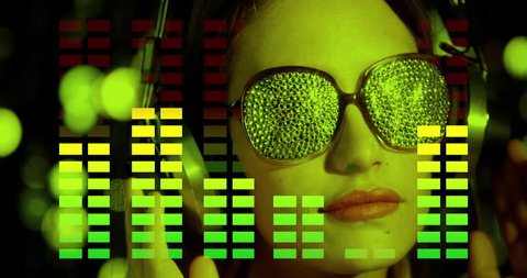 stunning sexy disco woman listening to music on headphones with crystal covered sunglasses. this clip is ovelayed with graphic equaliser motion graphics