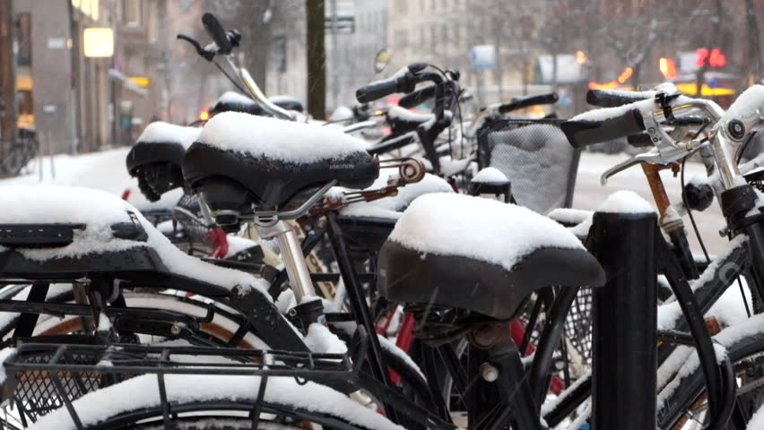 Snowing at bicycles