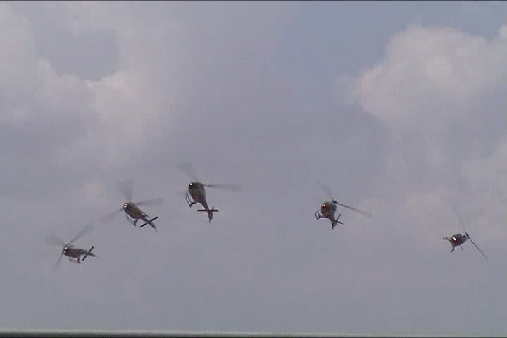 Military helicopter performing in an air show