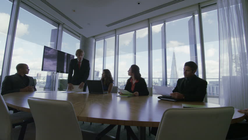 4k / Ultra HD version Corporate business team in boardroom meeting in London city office. In slow motion. Shot on RED Epic | Shutterstock HD Video #13953215