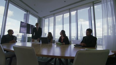 4k / Ultra HD version Corporate business team in boardroom meeting in London city office. In slow motion. Shot on RED Epic