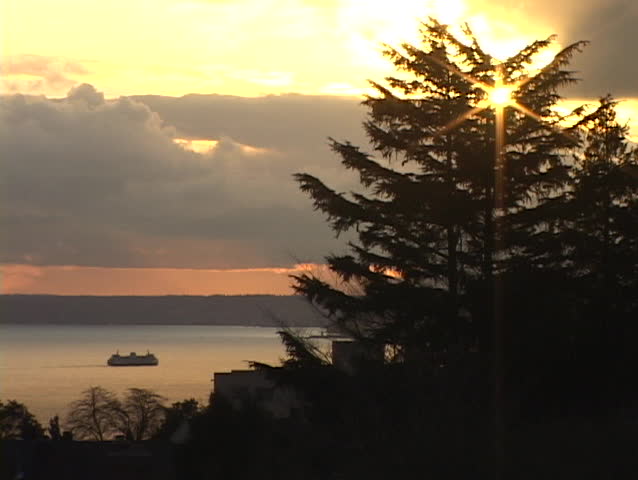 A ferry boat cruises on the calm waters of Puget Sound in Seattle, Washington.