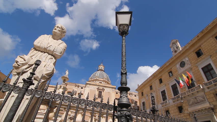 Sculpture, lamp and town hall in Piazza Pretoria, Palermo, Sicily, Italy.
