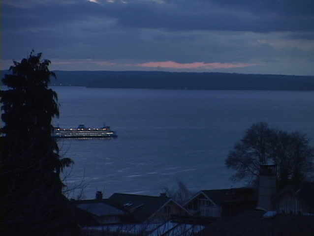 A ferryboat leaves the Seattle harbor.