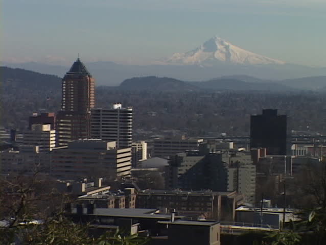 Mount Hood stands behind the Portland skyline.
