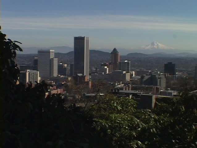 Mount Hood stands behind the Portland skyline.