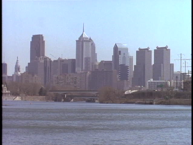 The Philadelphia skyline stands in the distance on a hazy day.