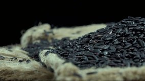 Rotating Black Rice as high detailed 4K UHD footage