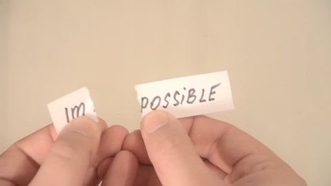 impossible turns to possible. Changing the word impossible to possible. Man makes the impossible possible