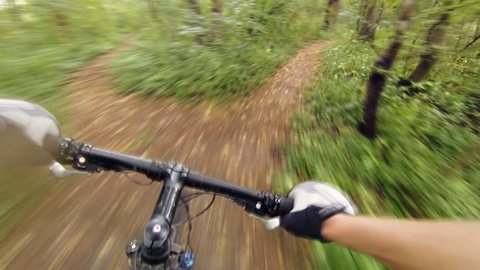 Speed riding downhill a MTB bike on rocky mountain. View from first person perspective POV. Inspiration and motivation extreme sport activity. Gimbal stabilized view.