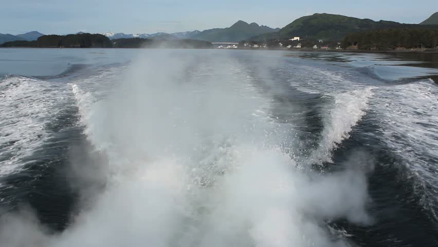 Rippling, frothy waves created by tour boat as it motors away from Kodiak Island, Alaska. 1080p  