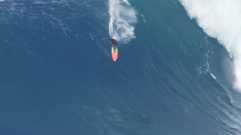 MAUI, HAWAII.  January, 15 2016: Big Wave Surfing Wipeout. Surfer Crashes on Giant Ocean Wave Surfing Jaws on North Shore in Hawaii.
