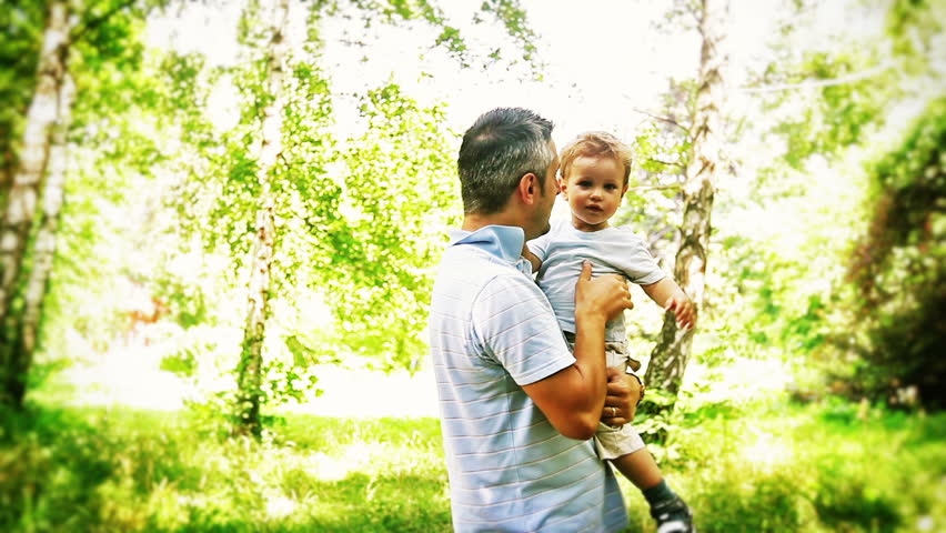 Adorable Baby Boy and Father in the Park