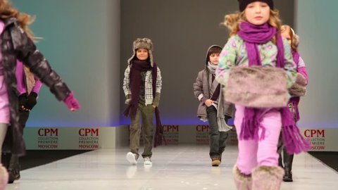 MOSCOW - FEBRUARY 22: Several kids in winter clothes from Snowimage Collection, Collection Premiere Moscow, on February 22, 2011 in Moscow, Russia.