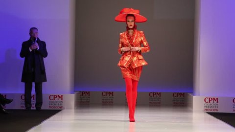 MOSCOW - FEBRUARY 22: Woman wears red suit and hat from Slava Zaytzev and  walks the catwalk in the Collection Premiere Moscow, on February 22, 2011 in Moscow, Russia. Editorial Stock Video