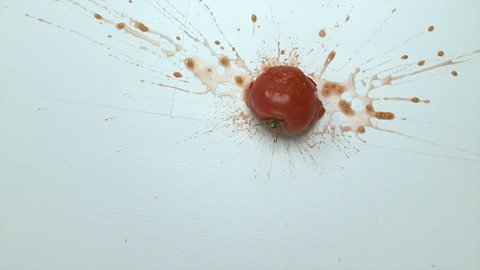 Crushing a tomato
