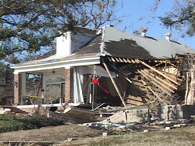 A home shows the complete destruction caused  Hurricane Katrina. | Shutterstock HD Video #1400515