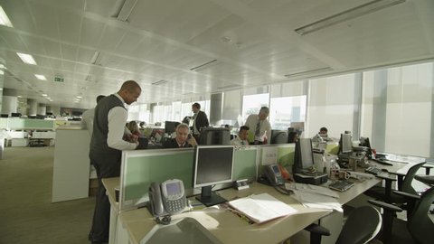 4k / Ultra HD version Diverse business group working together in large modern city office. Shot on RED Epic