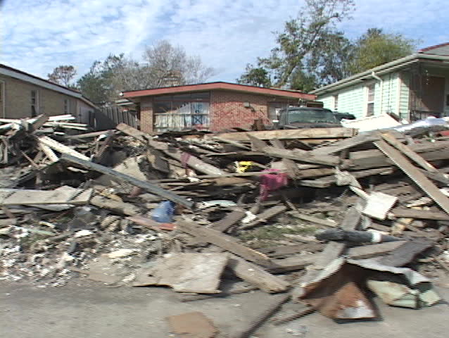 Rubble and debris piled along the side of the road shows the destruction caused by Hurricane Katrina.