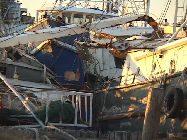 Boats rest on their sides ion the beach following Hurricane Katrina.