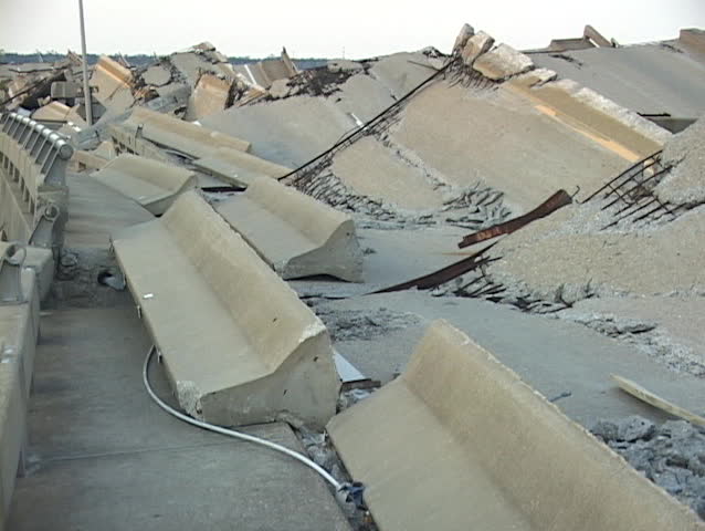 Water flows around a destroyed causeway along the Gulf Coast of Mississippi after Hurricane Katrina.