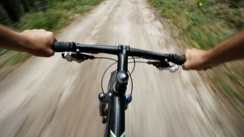 riding downhill bike on road