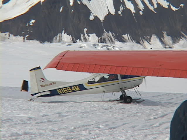 Wide shot of a ski plane on a glacier.
