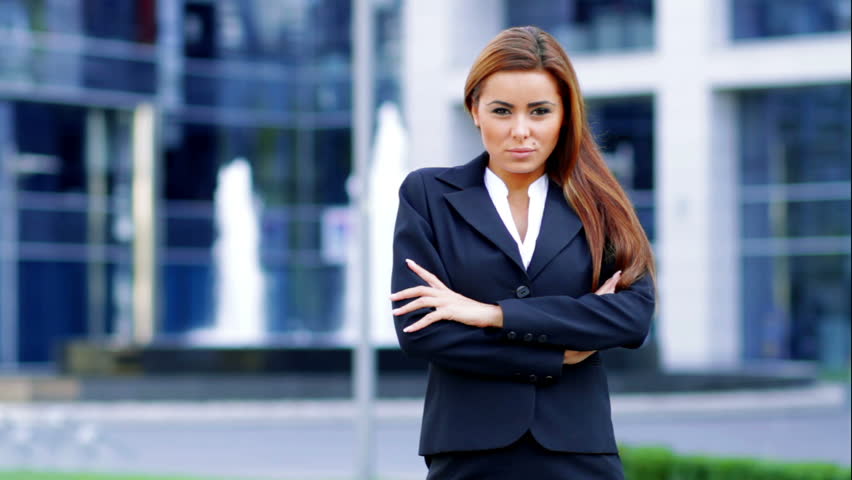 Adorable caucasian business woman outside office building