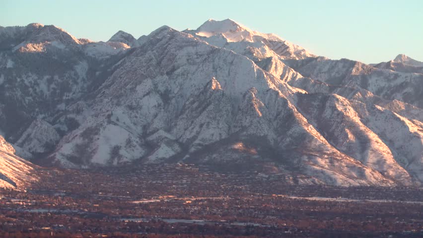 The Wasatch mountain range over looks the Salt Lake City valley at sunset.