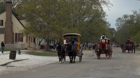WILLIAMSBURG, VIRGINIA - CIRCA JUN 2015: Colonial Williamsburg Virginia Historic Antique Horse carriage rides. Education tourism demonstrating the early American life. Revolutionary War restoration.