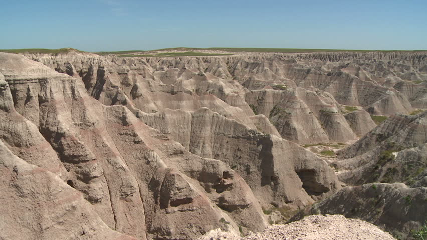 Camera pans left to right gently showing the landscape of the Badlands