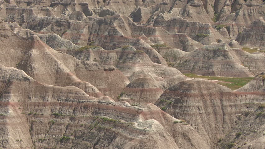 Camera pans left to right slowly revealing Badlands terrain