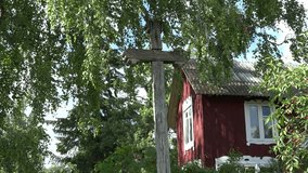 old vintage homemade cross and country wooden home in birch garden in summertime. 4K UHD video clip.