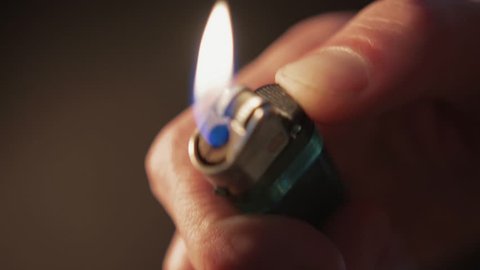 Lighter Igniting in Hand, Close up