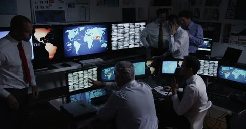 4k / Ultra HD version Time lapse of personnel who are manning the stations within a busy control room. This could be a station or airport control room. It could be a power station or control facility.
