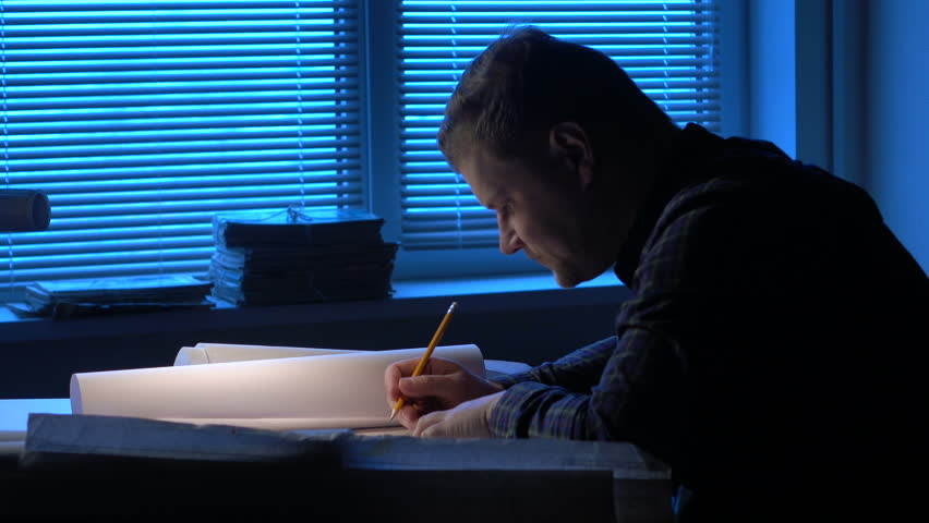 Tired and sad engineer works with the drawings. | Shutterstock HD Video #14051927