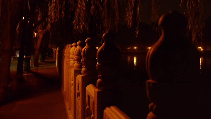 shore of stone railings.reflection on lake with splendid China ancient architectural lighting. gh2_03718
