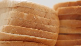 Toast bread slices pile of organic wheat and grain 4K 2160p 30fps UHD footage - Tasty fresh bread for toasting slow tilting 4K 3840X2160 UltraHD video