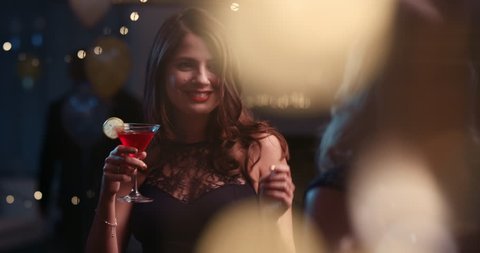Beautiful woman dancing having fun at glamorous sexy party drinking alcohol celebrating holidays